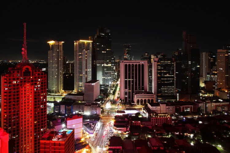 The City of Makati at night viewed from the Firefly Rooftop Bar of City Garden Hotel.